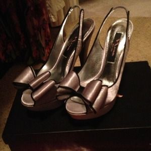 Silver Nina shoes with big bows and platform heels