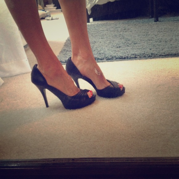 Like new black multi texture leathered heels. Sexy