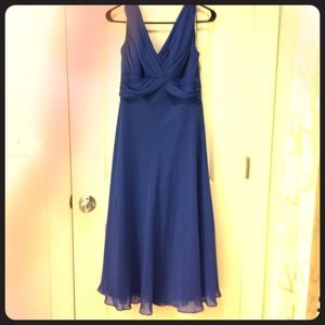 Tea-length empire waisted Greek-goddess dress.