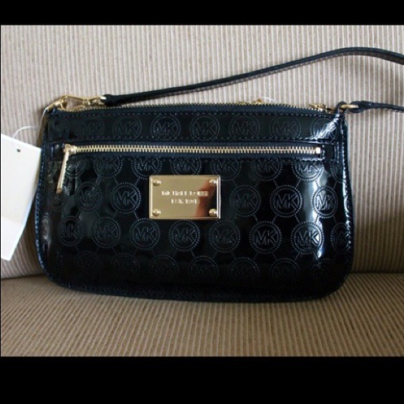 SOLD  KORS CLUTCH SIZE wristlet