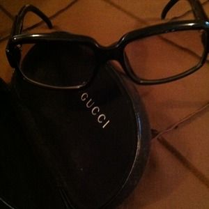 Gucci glasses (frames) and eyeglass case.