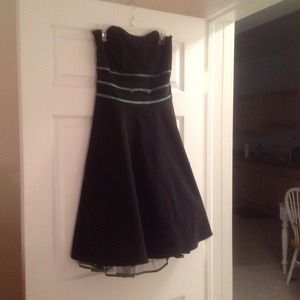 Black strapless dress with green ribbon