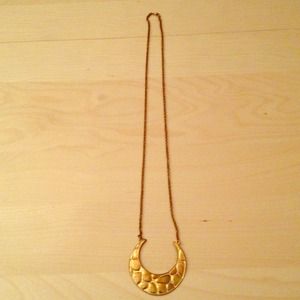 Gold u shaped pendant