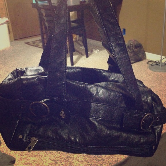 Distressed black Volcom purse.