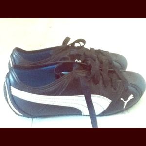 Like new! Black leather pumas