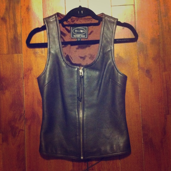 Genuine leather zip up corset vest.