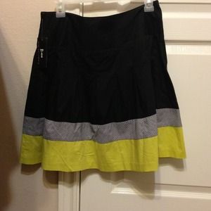 Black, green, and grey above knee length skirt.