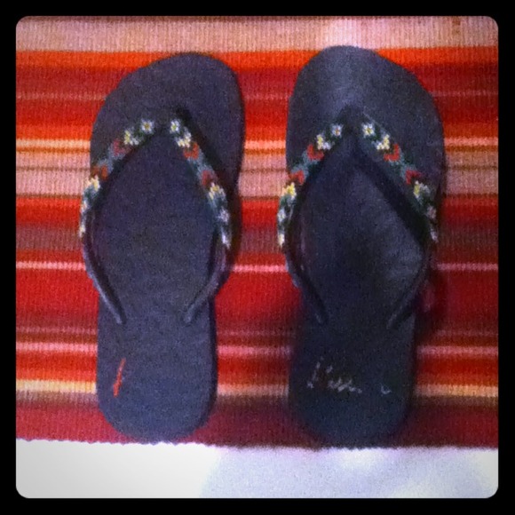 Black rosta colored flip flops