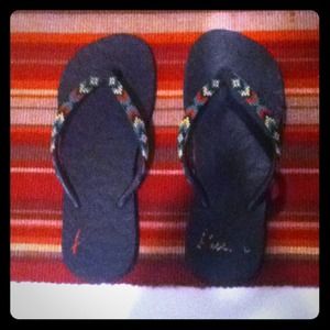 Black rosta colored flip flops
