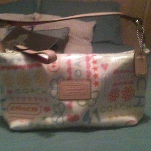 ---Auth. Coach makeup bag. Never used