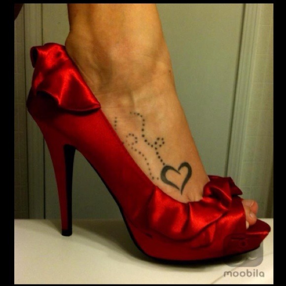 Red satin ruffle pumps