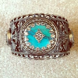 Silver cuff with turquoise accents.
