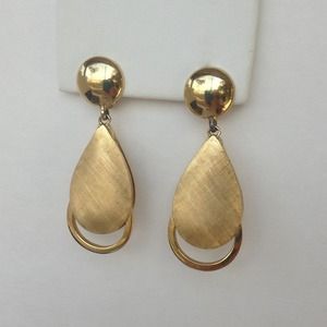 Clip on gold tone costume earrings preowned.