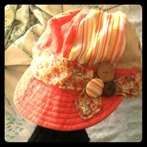 Pink hat with lovely patterns and buttons!