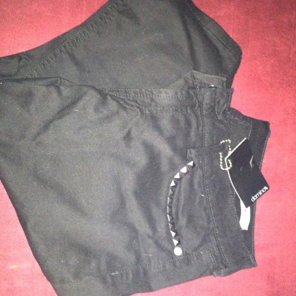 Black skinny studded jeans.