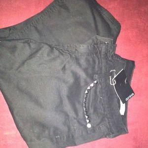 Black skinny studded jeans.