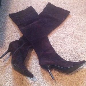 Bebe thigh high boots.