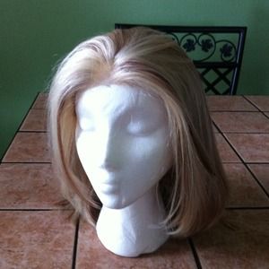 Blonde wig with ligh red highlights.