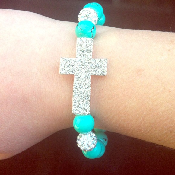 Turquoise diamond cross bracelet.
