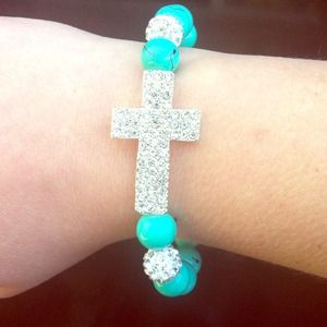 Turquoise diamond cross bracelet.