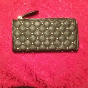 Black quilted/studded wallet.