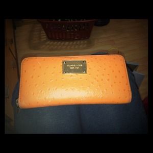 Tangerine Michael Kors zip around wallet