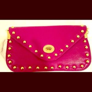 Bright pink clutch with gold nailhead trim