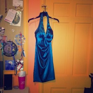 Tight fitting turquoise dress. Very cute. Size 4/5