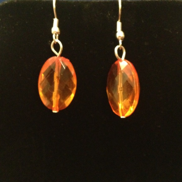Amber colored fish hook earrings.