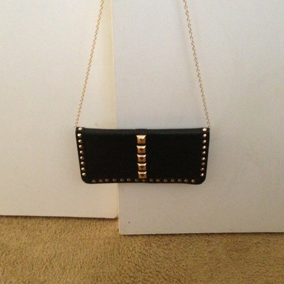 Traded Black purse with gold studs.