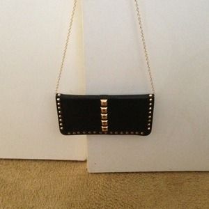 Traded Black purse with gold studs.