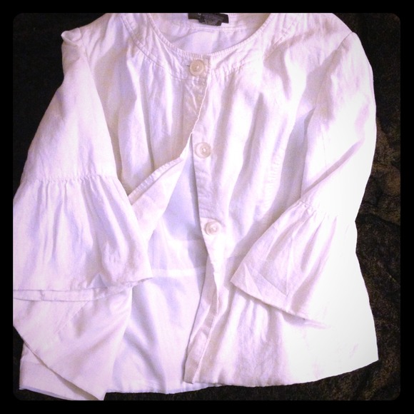 White jacket, cream overcoat and black silky shirt