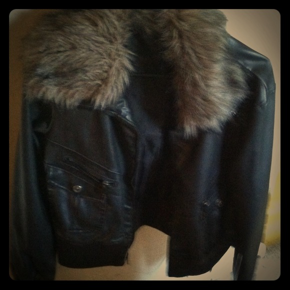 Black, greyish jacket with faux around the collar.