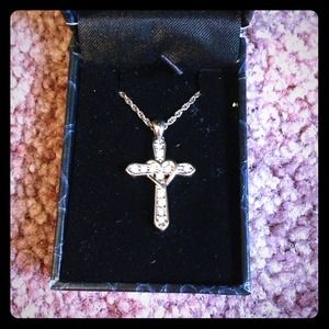 Gold cross necklace.
