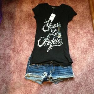 Never worn guess black v neck.