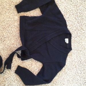 Black dance or figure skating sweater.