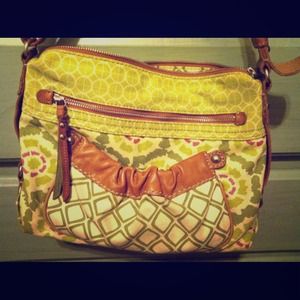 Like new, fossil cross body bag. Leather trim.