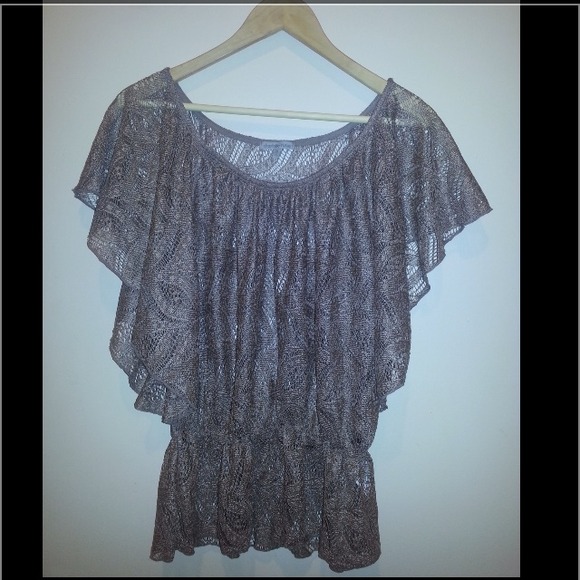 Brown laced see through shirt.