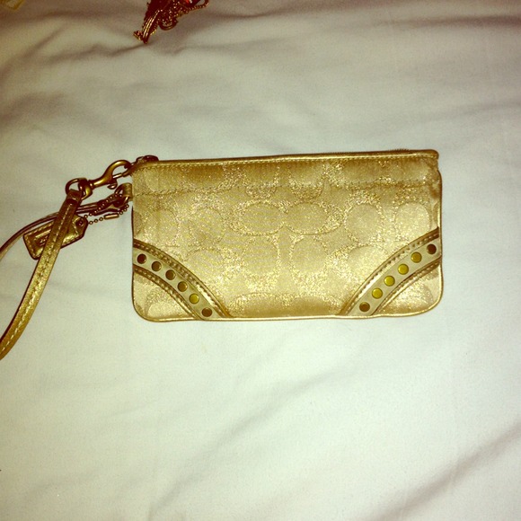 SOLD!!!!!! Authentic gold studded Coach wristlet