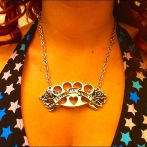 "Treat me right" brass knuckles necklace