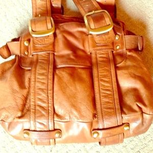 Soft leather purse with brass accents.