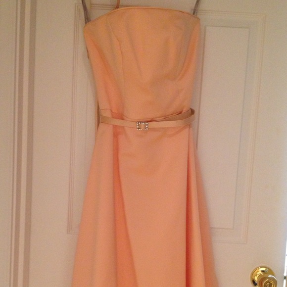 Beautiful bridesmaid / prom dress is peach fizz.