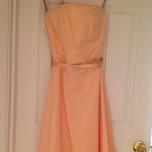 Beautiful bridesmaid / prom dress is peach fizz.