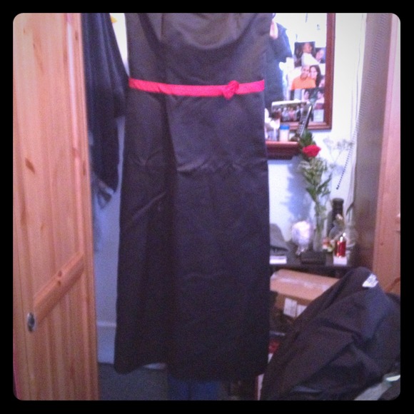 Black bridesmaid dress with red belt and rosette