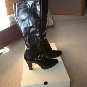 Black and brown knee boots with buckle.