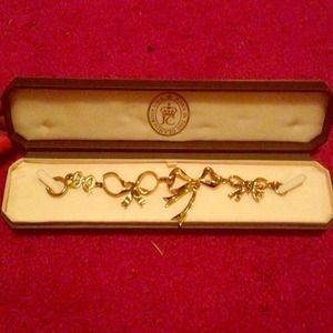 Juicy Couture bow bracelet.