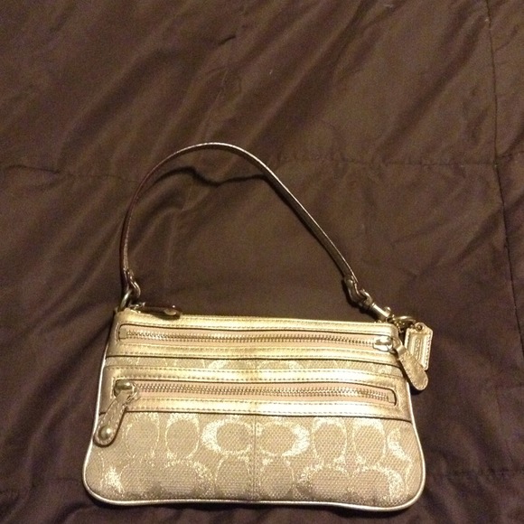 A coach wristlets. All gold.