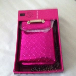 Pink metallic Nine West phone case and wallet.