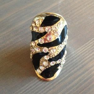 black, gold, and diamond accent ring