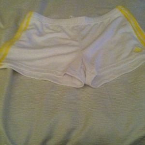 Adidas shorts white with yellow Adidas stripe